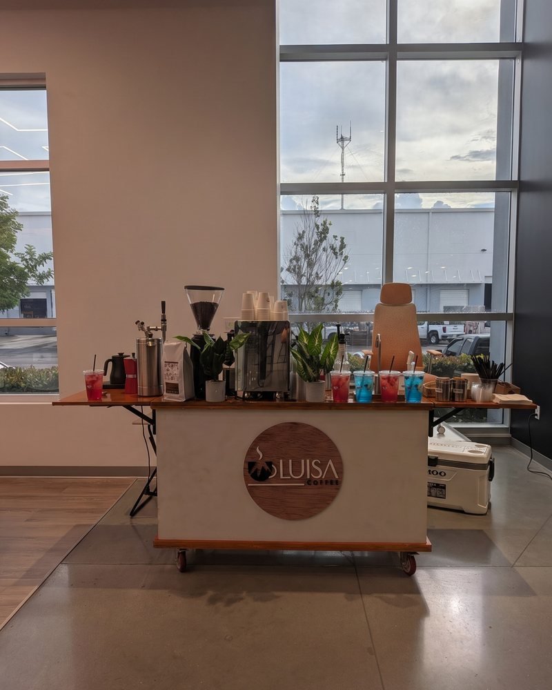The Miami Refresher Cart set up with refreshers and an espresso station in a large event space